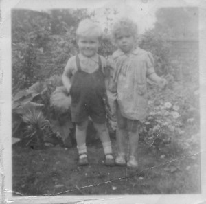 Brother Paul and neighbour in Grandma Beattie's house, 1948